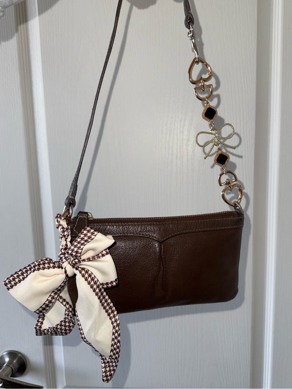 Dooney & Bourke Brown Leather Mini Shoulder Bag with Bow Accent